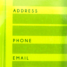 Load image into Gallery viewer, Close up to the green luggage tag. 
