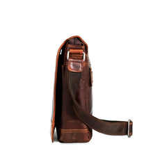 Load image into Gallery viewer, Side panel view of the brown leather messenger bag. 
