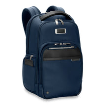 Load image into Gallery viewer, Angled front view of the navy blue backpack. It features three zipper-closing pockets on the front, and a one on the side.
