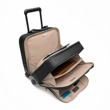 Load image into Gallery viewer, Angled view of the black spinner brief with the main and front compartments unzipped. A laptop, book, and accessories are organized in different pockets. 
