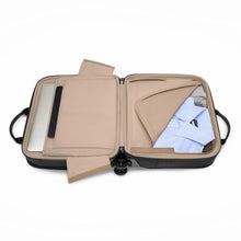 Load image into Gallery viewer, Interior view of the black spinner brief. IT features light tan fabric lining and zipper-closing panel dividers. A set of shirts are folded inside with a laptop. 
