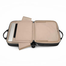 Load image into Gallery viewer, The black medium brief spinner, opened. It features tan fabric lining. A laptop is stored inside the padded compartment outside the panel divider. 
