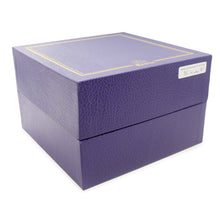 Load image into Gallery viewer, Angled front view of the outer purple presentation box.
