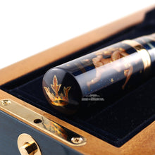 Load image into Gallery viewer, Angled close up to the top of the cap with a hand painted crown.
