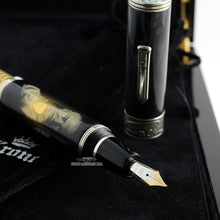 Load image into Gallery viewer, Close up to the fountain pen grip section, nib, and cap.
