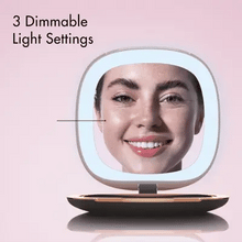 Load image into Gallery viewer, Front view of the opened black pocket mirror. A woman's smiling face is shown on the reflection. The text reads: three dimmable light settings. 
