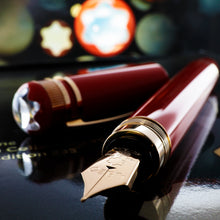 Load image into Gallery viewer, Angled view of the fountain pen and cap.
