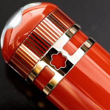 Load image into Gallery viewer, Close up to the golden rings at the top of the pen's cap. It features a cut out of the Montblanc logo.
