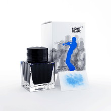 Load image into Gallery viewer, The ink bottle, packaging, and color sample on a white background.
