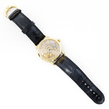 Load image into Gallery viewer, Luxury watch with black leather strap and gold case on a white background
