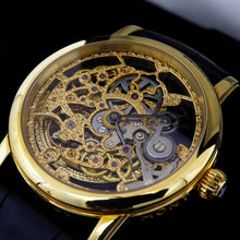 Load image into Gallery viewer, Angled front view of the gold watch face.
