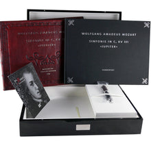 Load image into Gallery viewer, The fountain pen arranged with the presentation box, music books, and certificates.
