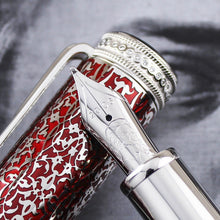 Load image into Gallery viewer, Close up to the pen nib resting on the cap.
