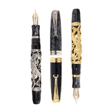 Load image into Gallery viewer, Uncapped Montegrappa Chinese Zodiac Horse fountain pens in gold and silver overlay, featuring intricate Horse engravings on black resin bodies, displayed on a white background.
