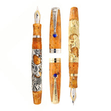 Load image into Gallery viewer, Uncapped Montegrappa Chinese Zodiac Pig fountain pens in gold and silver overlay, featuring intricate Pig engravings on Orange resin bodies, displayed on a white background.

