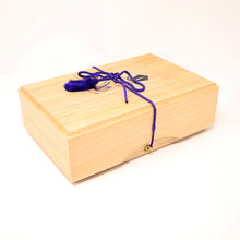Load image into Gallery viewer, Wooden box with a purple cord and decorative elements on a white background.
