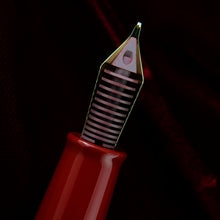 Load image into Gallery viewer, Close up to the red ink feed behind the pen's nib.
