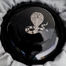 Load image into Gallery viewer, Close up to the ink bottle cap with a cobra design painted on.
