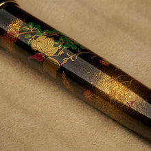 Load image into Gallery viewer, Close up to the painted flowers, leaves, and artist signature on the barrel

