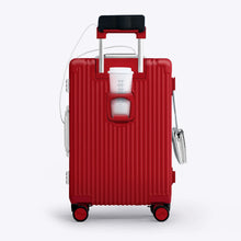Load image into Gallery viewer, 
Back panel view of the red suitcase showing a phone held by the telescopic handle and a hot drink in the cup holder.
