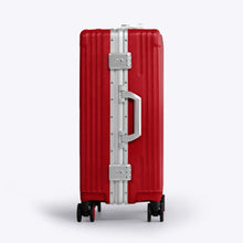 Load image into Gallery viewer, Side panel view of the red suitcase showing a grab handle, and two TSA approved three-digit combination locks. 

