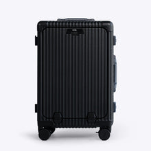 Load image into Gallery viewer, Front panel view of the black carry-on suitcase. The telescopic handle is retracted. 
