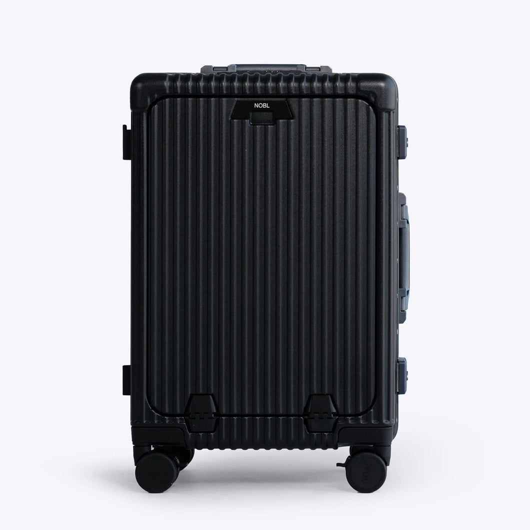 Front panel view of the black carry-on suitcase. The telescopic handle is retracted. 