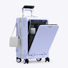 Load image into Gallery viewer, Angled front view of the lavender carry-on with the front panel opened. It is arranged with a charging cellphone, a small purse, and a laptop in its compartment. 

