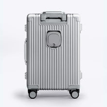 Load image into Gallery viewer, Back panel view of the silver colored suitcase. 
