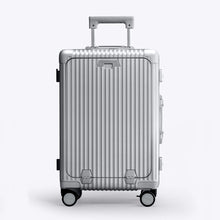 Load image into Gallery viewer, Front panel view of the silver colored suitcase. The telescopic handle is partly extended. 
