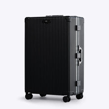 Load image into Gallery viewer, Angled front view of the black Large suitcase with silver-colored accents. The telescopic handle is retracted. 
