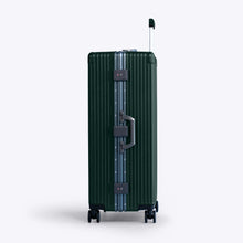 Load image into Gallery viewer, Side panel view of the green suitcase. It features a grab handle, and two TSA approved three-digit combination locks. 
