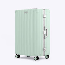 Load image into Gallery viewer, Angled front view of the light green suitcase. 
