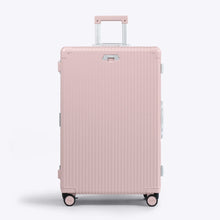 Load image into Gallery viewer, Front panel view of the large pink suitcase with silver-colored accents. The telescopic handle is extended. 
