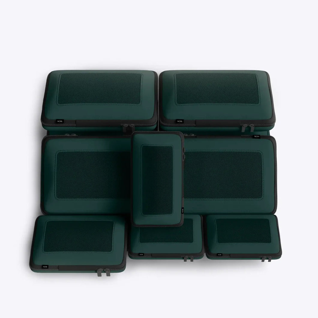 Set of green cases stacked on a white background