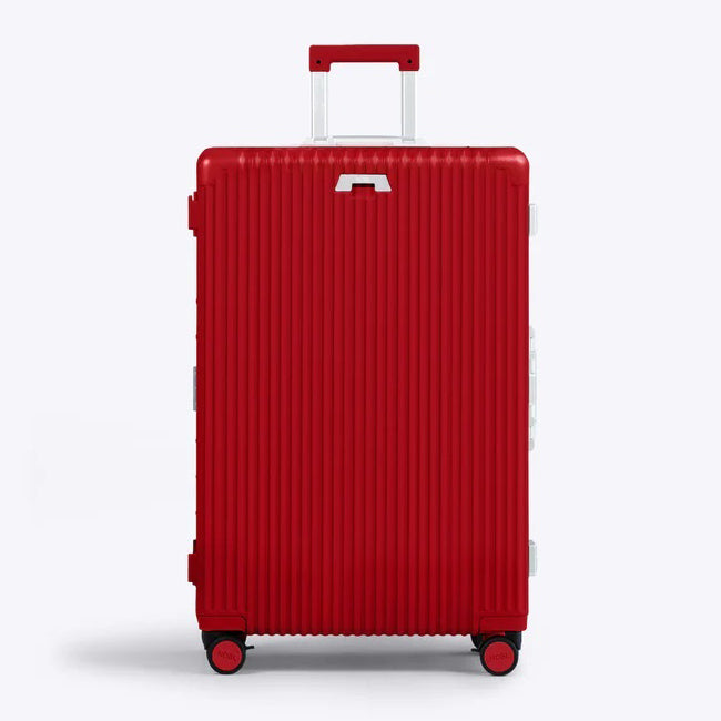 Front panel view of the red suitcase with the telescopic handle partly extended. 