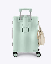 Load image into Gallery viewer, A light mind green carry-on suitcase with a matching-color water bottle in the cup holder on the back panel. 
