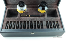Load image into Gallery viewer, Nib set with two glass bottles, a pen, and multiple nibs in a case on a white background.

