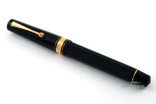 Load image into Gallery viewer, Black fountain pen with gold accents on a white background
