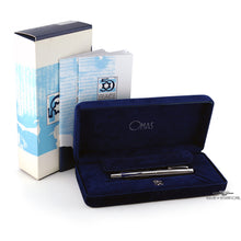 Load image into Gallery viewer, The pen is shown in its navy  presentation box. Behind, the certificates and outer box are presented on a white background.
