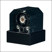 Load image into Gallery viewer, A black watch winder with a transparent protective cover and a single watch displayed inside on a white background.

