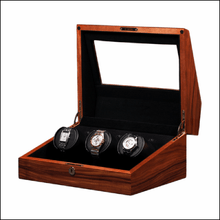 Load image into Gallery viewer, Wooden watch winder display case with three watches on a white background
