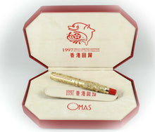Load image into Gallery viewer, Gold pen with red accents in a decorative box, featuring OMAS branding and &#39;1997&#39; text.
