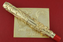 Load image into Gallery viewer, Gold and red pen with intricate design on a red background
