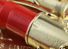 Load image into Gallery viewer, Close-up of the pen with 043/200 and 750 markings.
