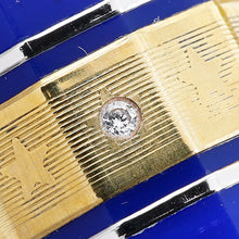 Load image into Gallery viewer, Close up to a small diamond encrusted in the pen's cap band. The cap band shows brush marks and patina.
