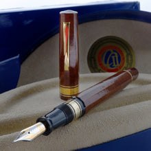 Load image into Gallery viewer, The fountain pen arranged with the cap behind it on the presentation box.
