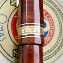 Load image into Gallery viewer, Close up to the cap's engraved golden ring. It has some patina and brush marks.
