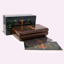 Load image into Gallery viewer, The wooden presentation box arranged with the booklets and outer box on a white background. 
