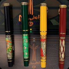 Load image into Gallery viewer, Back view of the green and black, green, yellow and orange, and red fountain pens with golden accents. 
